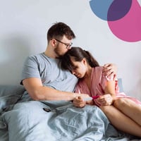 Couple facing infertility embracing and comforting each other