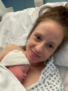 A new born baby with her IVF warrior mother. 