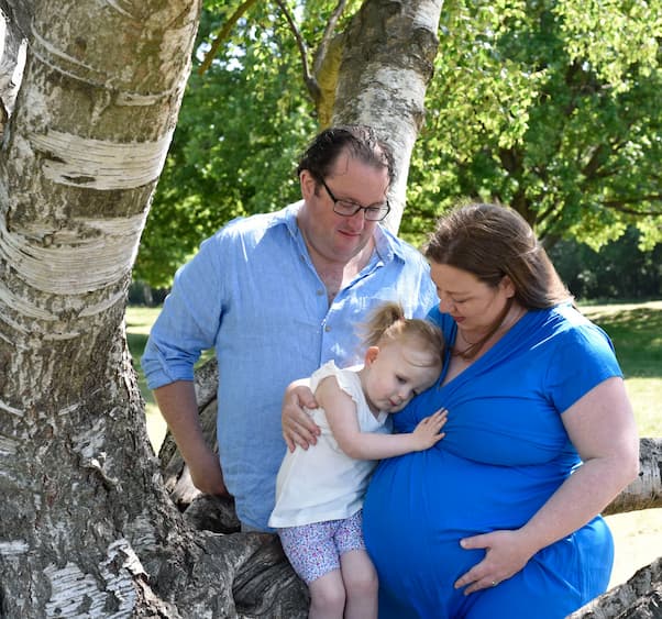IVF pregnant patient with husband and daughter