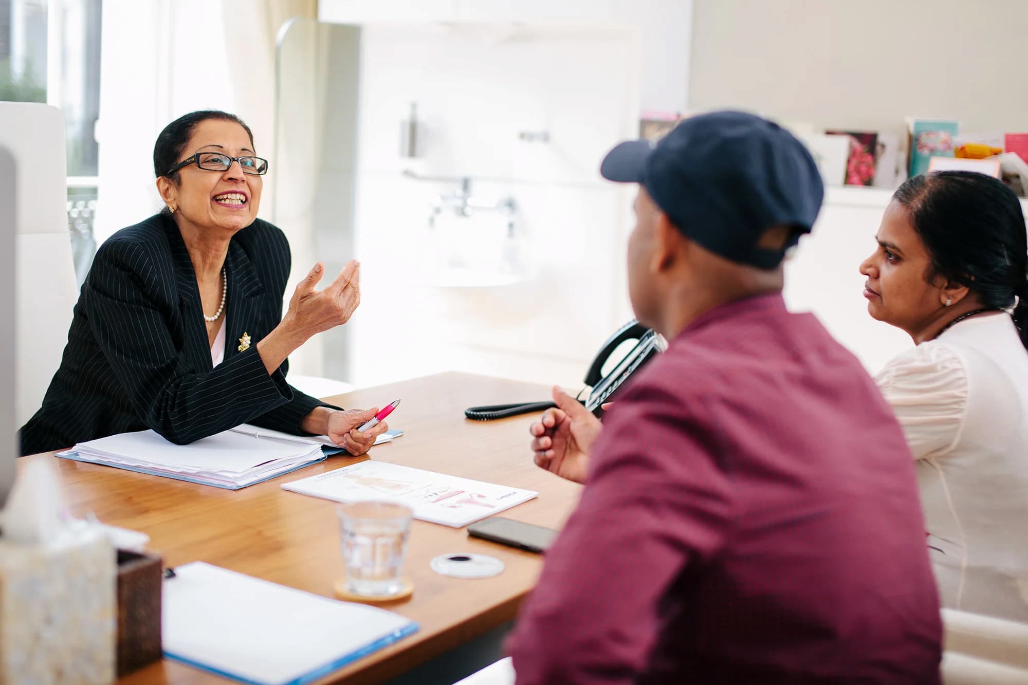 Dr Venkat speaking with Asian patients