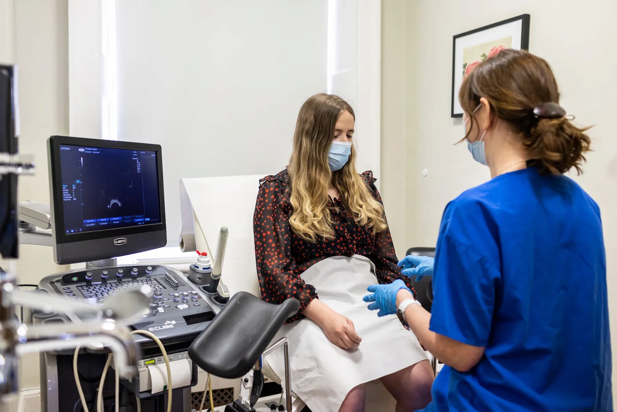 Patient and fertility doctor in a scan room