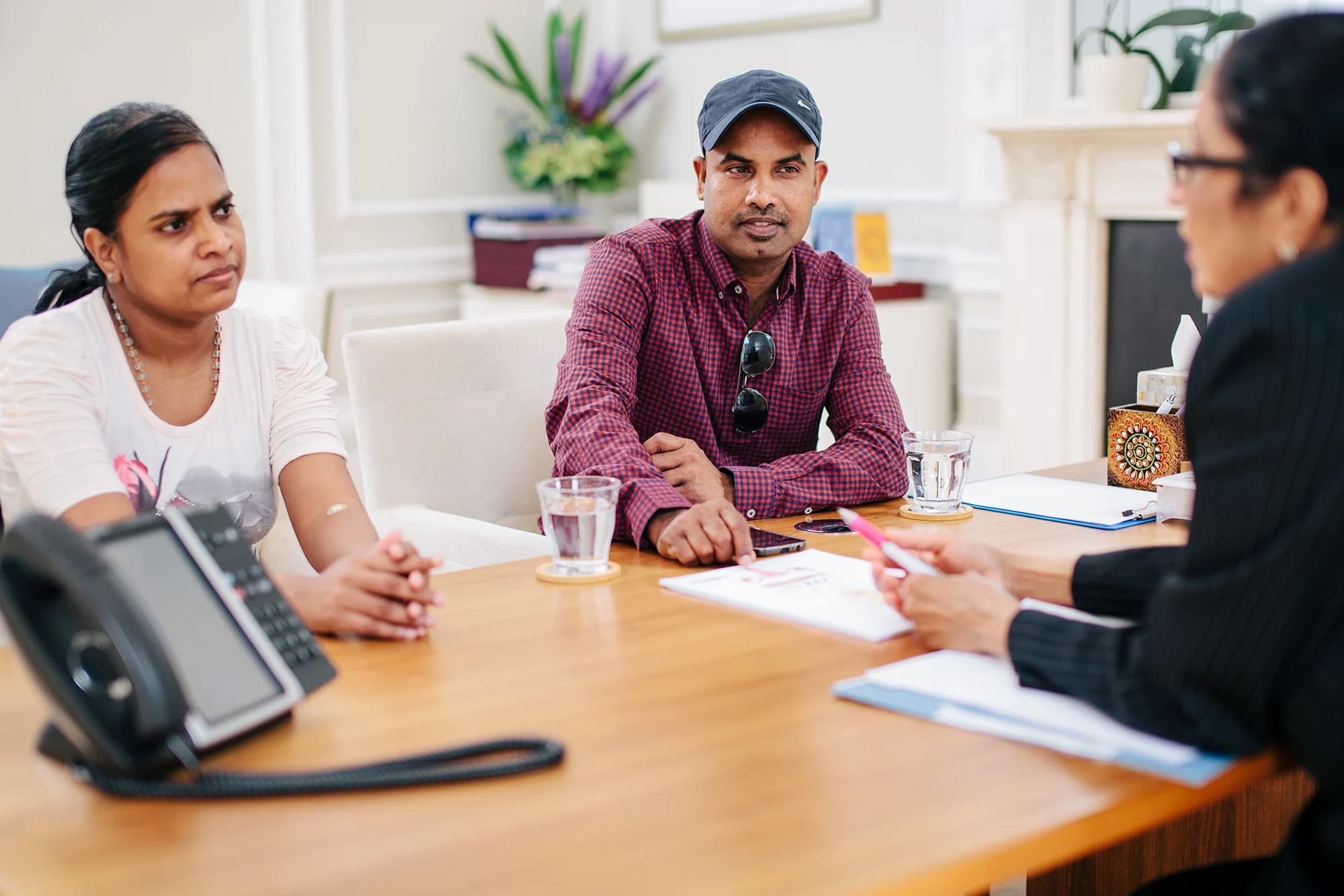 South-Asian couple talking to Dr Venkat