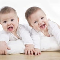 Two babies laughing 