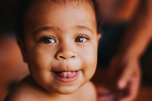 Indian baby with his tongue out